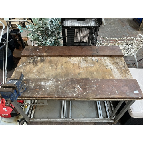 773 - A cast iron and wooden topped workbench with Record no.2 bench vice - approx. 78cm high x 123cm wide... 