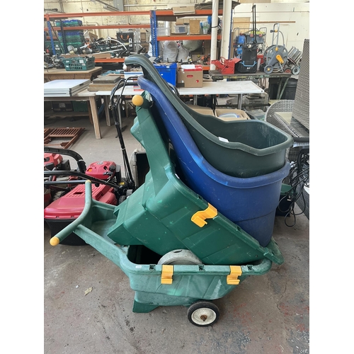 786 - Four plastic wheelbarrows