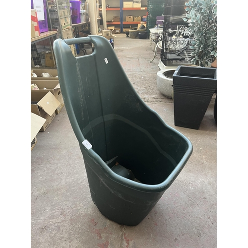 786 - Four plastic wheelbarrows