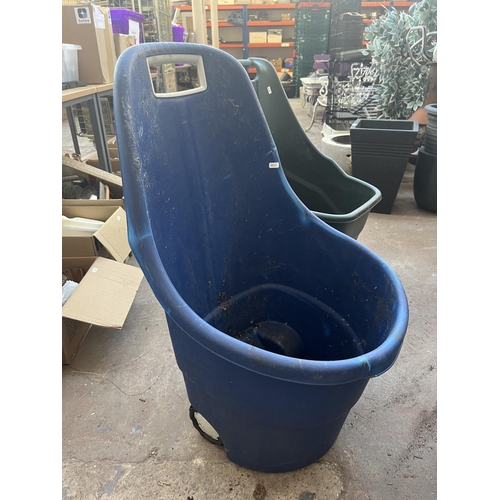 786 - Four plastic wheelbarrows