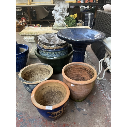 792 - Eight garden items, one glazed birdbath, five planters and two hanging baskets