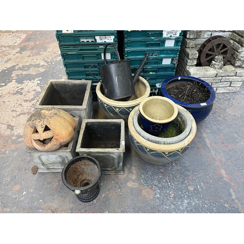 795 - A collection of garden items to include glazed planters, black painted galvanised watering can, 19th... 