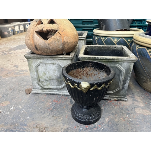 795 - A collection of garden items to include glazed planters, black painted galvanised watering can, 19th... 