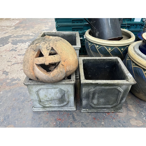 795 - A collection of garden items to include glazed planters, black painted galvanised watering can, 19th... 