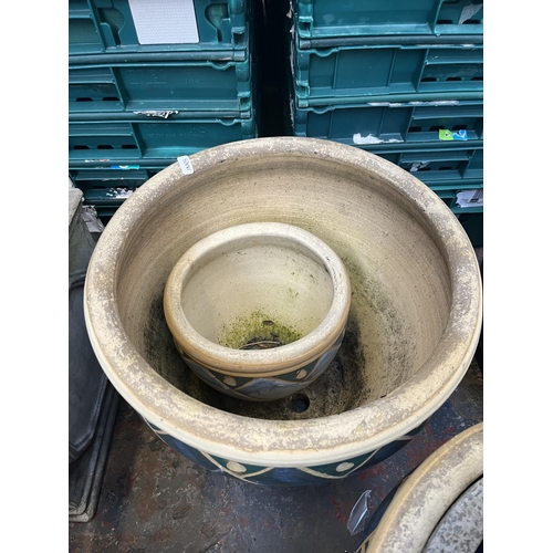 795 - A collection of garden items to include glazed planters, black painted galvanised watering can, 19th... 