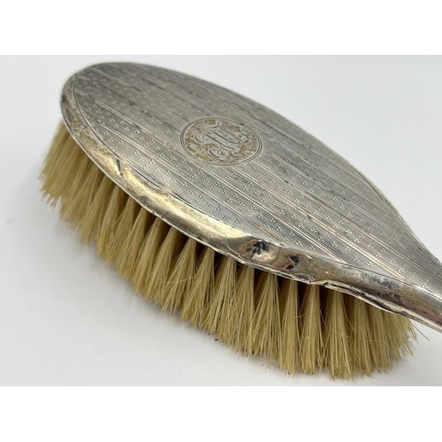 1319 - A hallmarked Birmingham silver hair brush, dated 1921 - approx. gross weight 124 grams