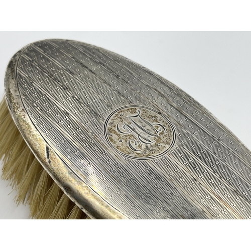 1319 - A hallmarked Birmingham silver hair brush, dated 1921 - approx. gross weight 124 grams