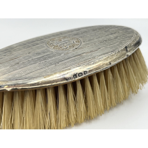 1319 - A hallmarked Birmingham silver hair brush, dated 1921 - approx. gross weight 124 grams