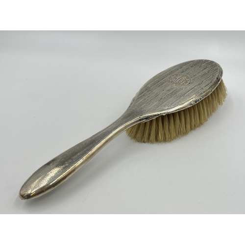 1319 - A hallmarked Birmingham silver hair brush, dated 1921 - approx. gross weight 124 grams