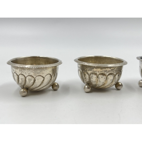 1322 - Four Victorian Harwood, Plante & Harrison hallmarked Birmingham silver tri-footed circular salt cell... 