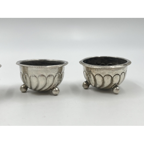 1322 - Four Victorian Harwood, Plante & Harrison hallmarked Birmingham silver tri-footed circular salt cell... 