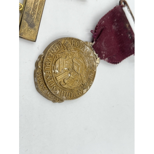 1402 - Five military items, two WWI medals presented to 117968 Pte. L. J. Warren M. G. C, two cap badges an... 