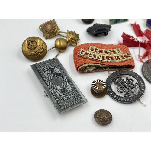 1404 - A collection of badges and buttons to include some military examples