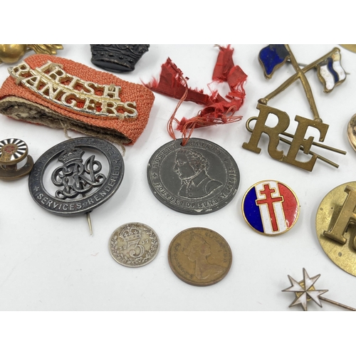 1404 - A collection of badges and buttons to include some military examples