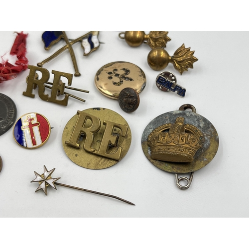 1404 - A collection of badges and buttons to include some military examples