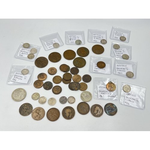 1429 - A collection of George V coins with silver examples to include 1928 florin, 1920s shilling, two 1916... 