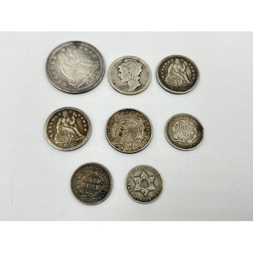 1434 - A collection of mostly 90% silver American coins, 1858 Seated Liberty ¼ dollar, 1916 Mercury dime, 1... 