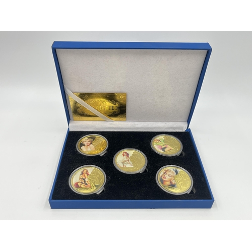 1440 - A cased set of five Marilyn Monroe 24k gold plated commemorative coins with certificate of authentic... 