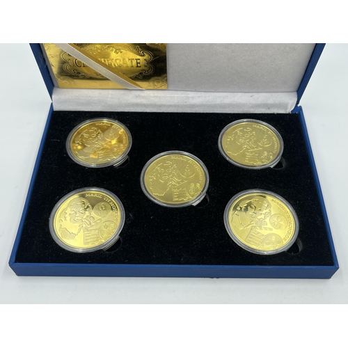 1440 - A cased set of five Marilyn Monroe 24k gold plated commemorative coins with certificate of authentic... 