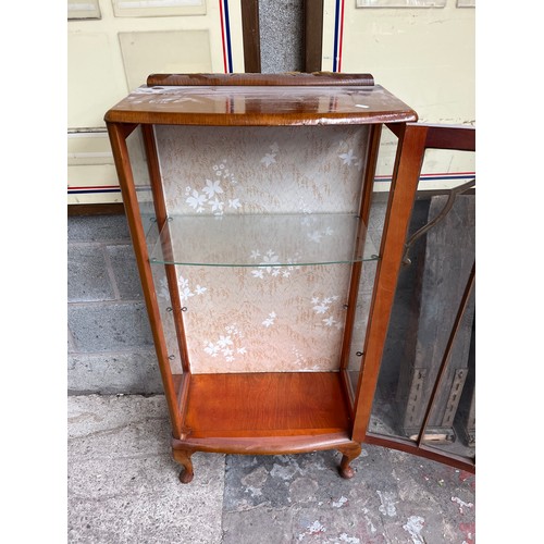 2 - A mid 20th century oak display cabinet with cabriole supports