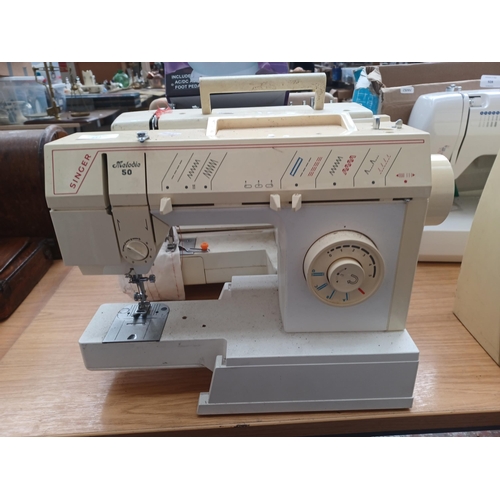 927 - Four electric sewing machines, one cased Janome New Home 921, one boxed SM-202A Mini with foot pedal... 