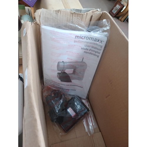 928 - A boxed Micromaxx MD13343 free arm, 21 stitch pattern, 53 programme, 770spm electric sewing machine ... 