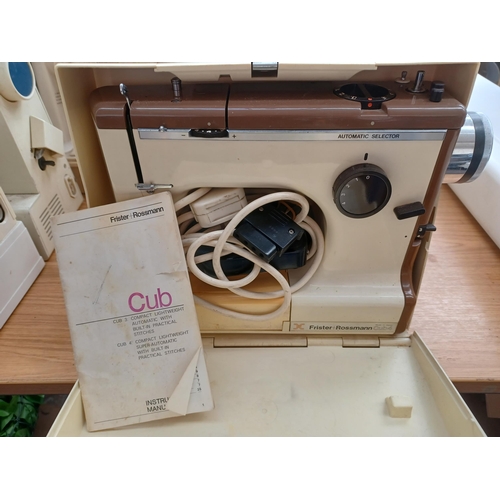 929 - A cased Frister + Rossmann Cub 4 compact lightweight super automatic electric sewing machine with fo... 