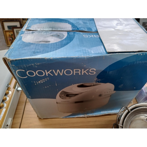 931 - A collection of kitchen items to include boxed Cookworks bread maker, Swan pans, Prestige steamer et... 