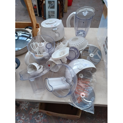 934 - A Kenwood food processor with a large quantity of attachments and accessories