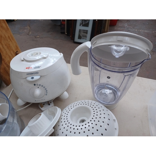 934 - A Kenwood food processor with a large quantity of attachments and accessories