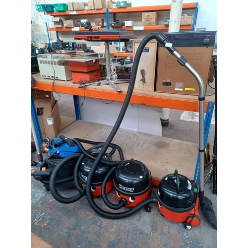 938 - Four vacuum cleaners, three Henry and one Mastervac MV12