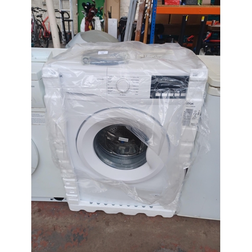 954 - A Logik L712WM20 7kg 1200rpm spin 60cm washing machine with instruction manual, pipe and fixings