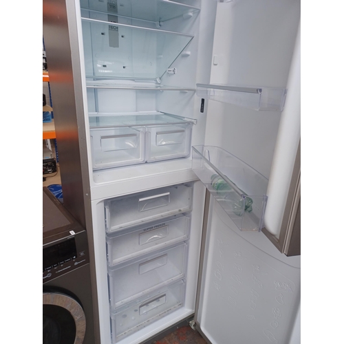 962 - A Hotpoint upright fridge freezer - approx. 188cm high