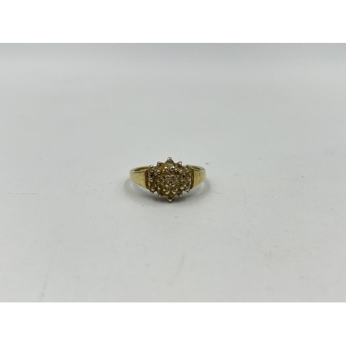 1246 - A 9ct gold diamond cluster ring, size O - approx. gross weight 3.14 grams