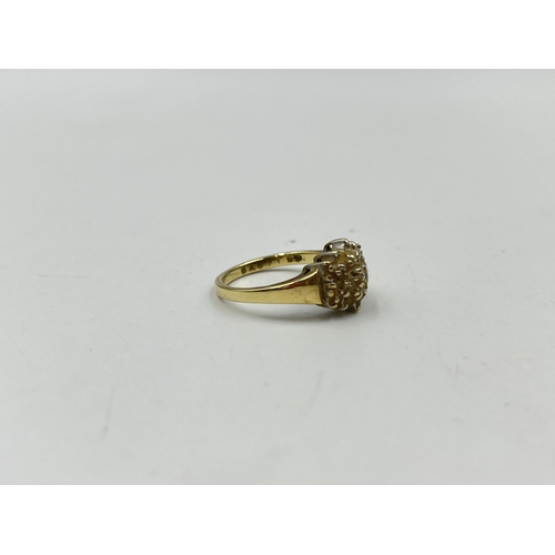 1246 - A 9ct gold diamond cluster ring, size O - approx. gross weight 3.14 grams