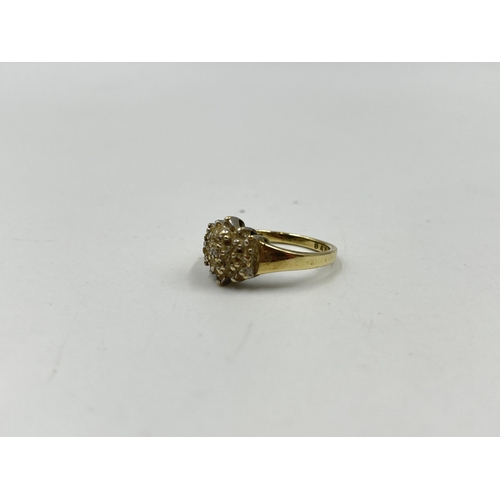 1246 - A 9ct gold diamond cluster ring, size O - approx. gross weight 3.14 grams