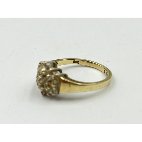 1246 - A 9ct gold diamond cluster ring, size O - approx. gross weight 3.14 grams