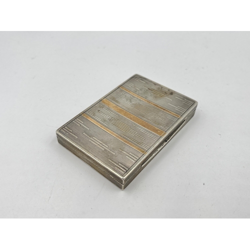 1335 - A stamped .835 silver engine turned cigarette case with rolled gold detail - approx. gross weight 51... 