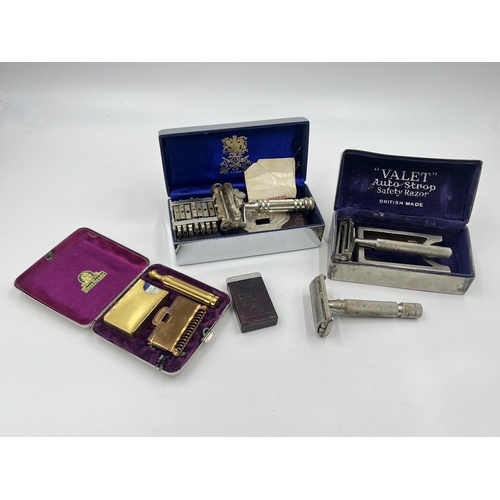 1427 - Four vintage gent's grooming razors and blades to include Gillette, Wilkinsons etc.