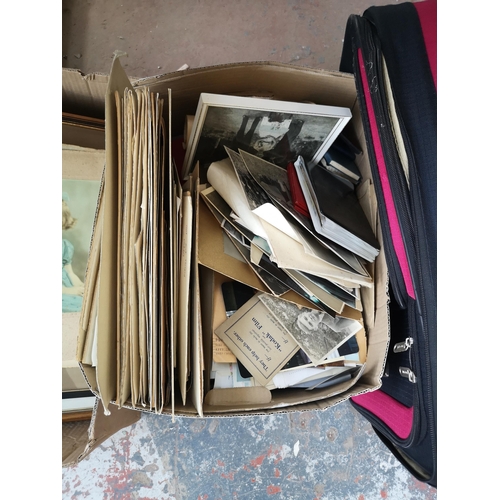 982A - Four boxes containing glassware, vintage photographs etc.