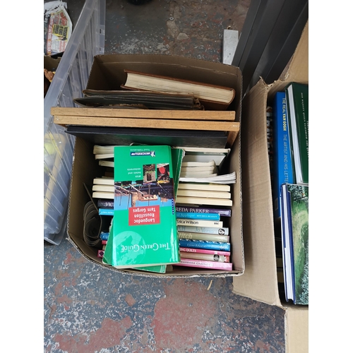 982C - Four boxes containing a large quantity of books, Ring Lighting black plastic desk lamp etc.