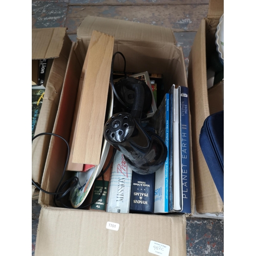 982C - Four boxes containing a large quantity of books, Ring Lighting black plastic desk lamp etc.