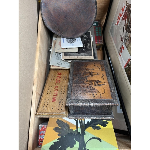 976 - Three boxes containing house clearance items to include Wills's Star Cigarettes cribbage board, blac... 