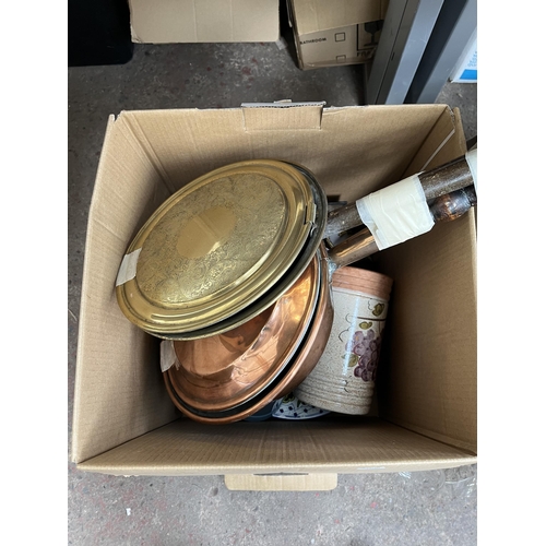 976C - Two boxes containing books, ceramics, two Victorian bed warming pans etc.