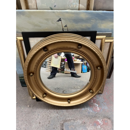 981A - A collection of pictures and mirrors to include Regency style gilt framed circular convex wall mirro... 