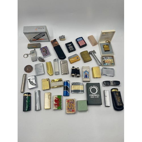 670D - A collection of cigarette lighters to include Merlin, Sim etc.