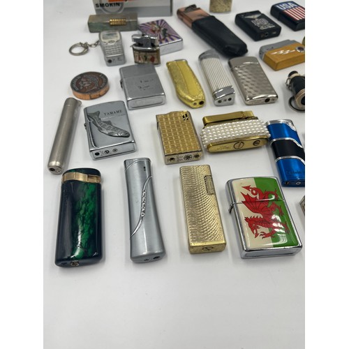 670D - A collection of cigarette lighters to include Merlin, Sim etc.