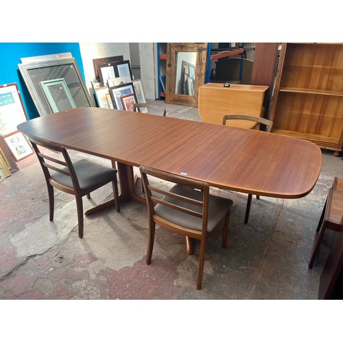 19 - A mid 20th century teak extending dining table and four G Plan teak dining chairs - approx. 250cm wh... 