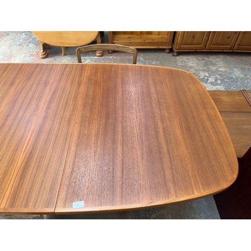 19 - A mid 20th century teak extending dining table and four G Plan teak dining chairs - approx. 250cm wh... 