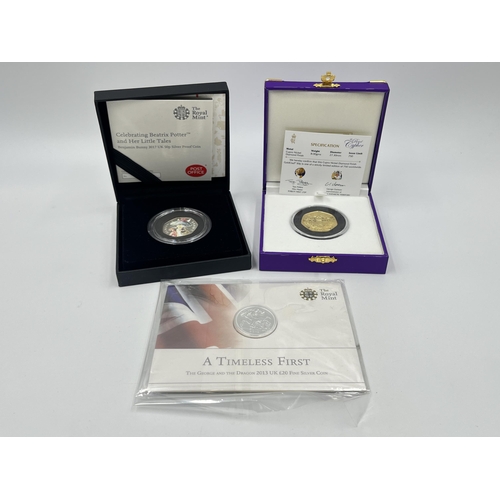 1443A - Three British commemorative coins, The Royal Mint A Timeless First the George and the Dragon 2013 UK... 